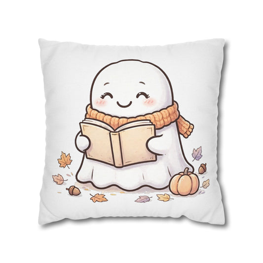 White throw pillow cover with a cute ghost reading a book