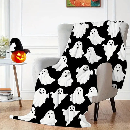 Flannel throw blanket with cute ghost figures for Halloween